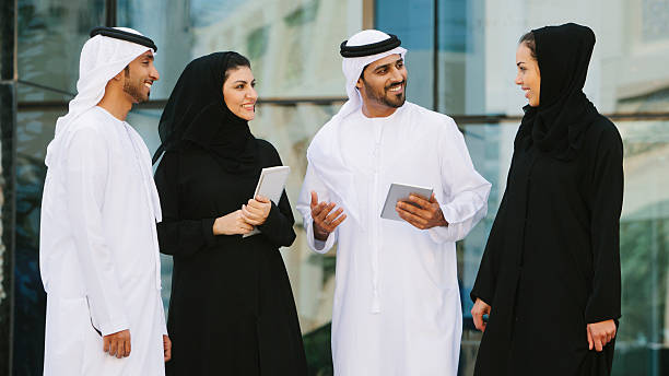 Four middle eastern business people chatting