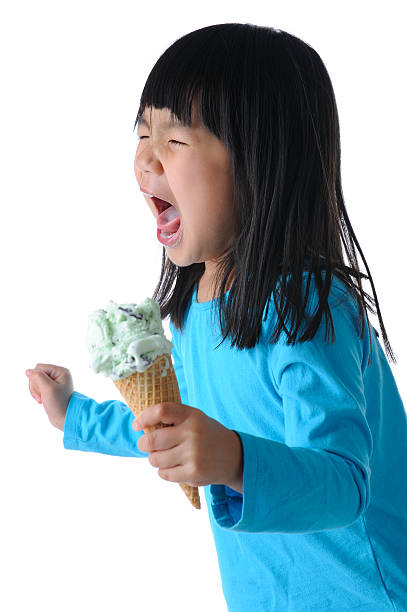 LIttle Girl Screaming From Ice Cream Heachace stock photo