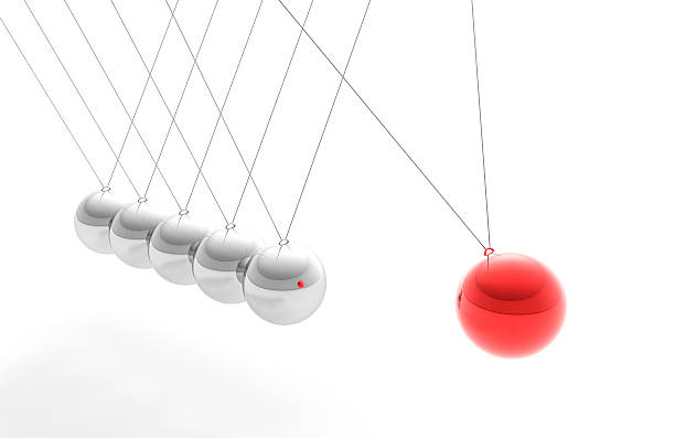 Newton's Cradle with Red Sphere, Individuality Concept (XXXL) High resolution render of Newton's Cradle, with a Red sphere, trying to interpret motion  and individuality and "standing out from the crowd" concept. perpetual motion stock pictures, royalty-free photos & images