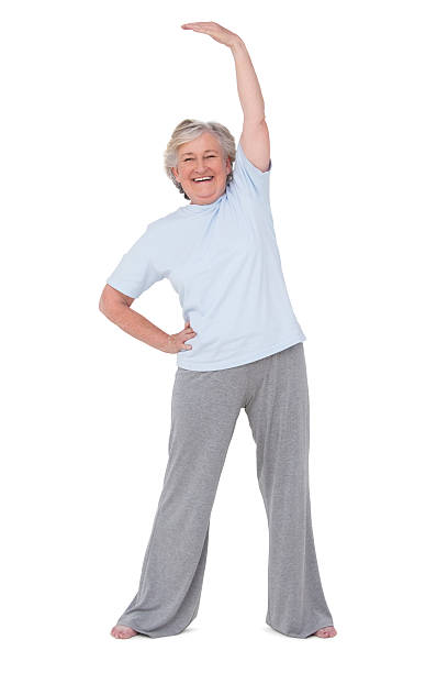 istock Senior woman stretching her arms 471253642