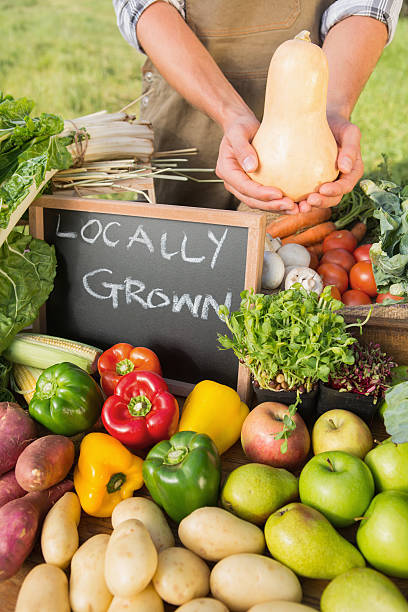 istock Farmer showing his organic squash 471254466