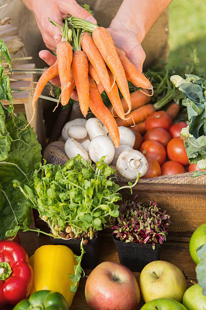 istock Farmer showing his organic carrots 471254470