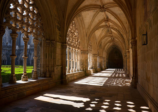 Royal Cloister of Batalha Abbey, Portugal The Royal Cloister of Batalha Abbey. Mosteiro Santa Maria da Vitória, more commonly known as the Batalha Monastery, is a Dominican convent in the Portuguese town of Batalha. It is one of the best and original examples of Late Gothic architecture in Portugal, intermingled with the Manueline style. batalha abbey photos stock pictures, royalty-free photos & images