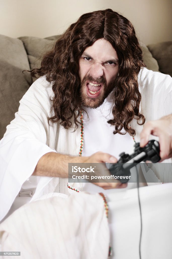 Jesús riproduzione di Video giochi - Foto stock royalty-free di Uomini