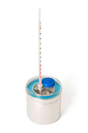 Laboratory Calorimeter and Thermometer. On white background