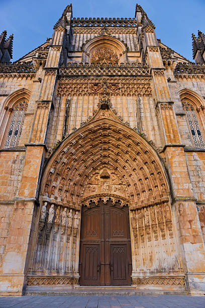 Facade of Batalha Abbey in Portugal Mosteiro Santa Maria da Vitória, more commonly known as the Batalha Monastery, is a Dominican convent in the Portuguese town of Batalha. It is one of the best and original examples of Late Gothic architecture in Portugal, intermingled with the Manueline style. batalha abbey photos stock pictures, royalty-free photos & images
