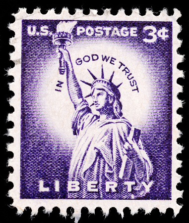 Vintage canceled stamp three cent Statue of Liberty with text: In God We Trust\