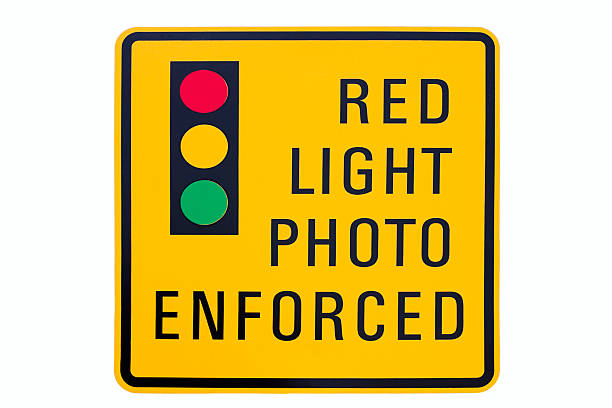 istock Red light photo enforcement sign 471260233
