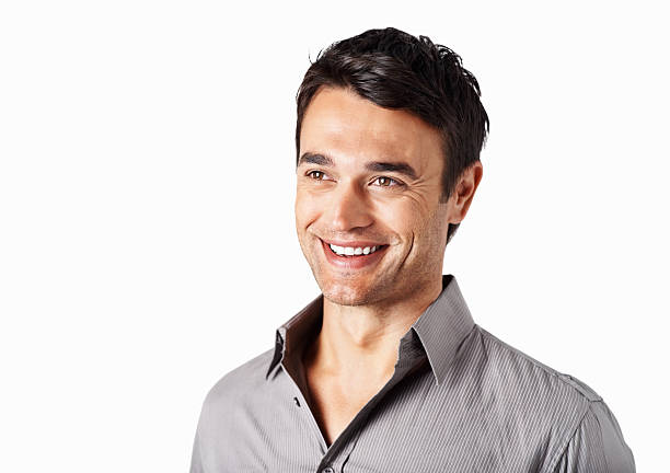 istock Smiling handsome man standing isolated against white background 471261229