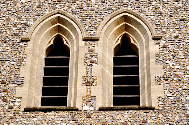 igreja torre com sino de janela de ventilação - built structure church flint stone imagens e fotografias de stock