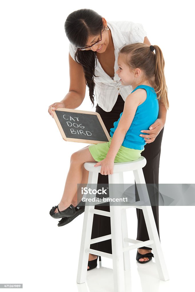 Lehrer unterrichten Junge Mädchen lesen - Lizenzfrei Lehrkraft Stock-Foto