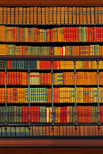 Wooden vintage bookshelf with antique books stock photo