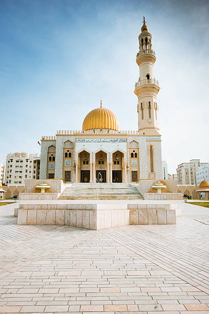 Al Khuwair Mosque Sultanate of Oman Muscat Famous Al Khuwair Mosque with minaret and golden dome Al Khuwair. Fountain in front stairway. Ibadi Muslim Mosque. Muscat, Sultanate Oman onion dome stock pictures, royalty-free photos & images