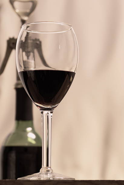 istock Table's Edge Wineglass Bottle Corkscrew 471262667