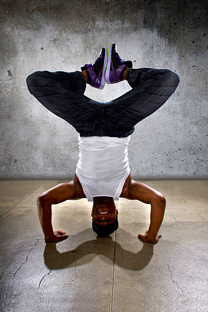 istock Urban Dancer Doing a Headstand or Yoga 471263414