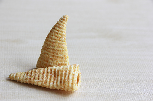 Cone of Corns Snack on Wood Background