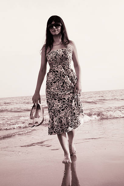 istock Woman on the beach 471265079