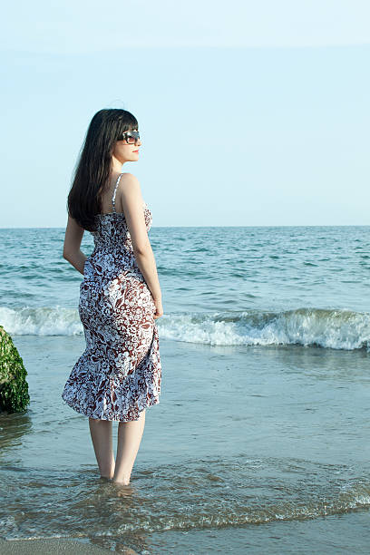 istock Woman on the beach 471267553