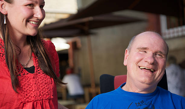 istock Man with disabiity and young woman 471268123