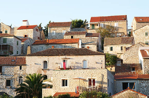 Old houses in Hvar lit by morning sun.