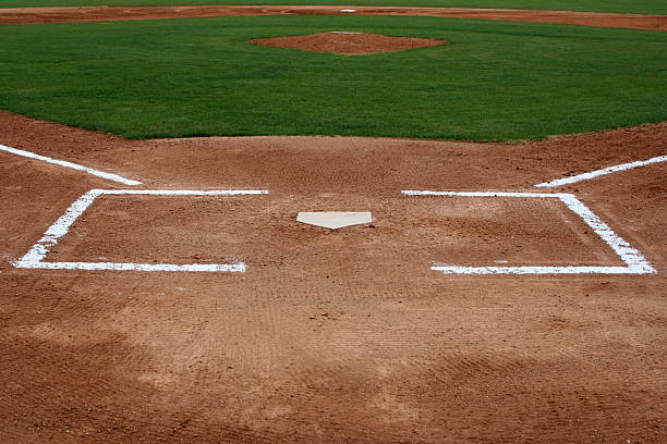 baseball field at home plate - traditionelle sportarten stock-fotos und bilder