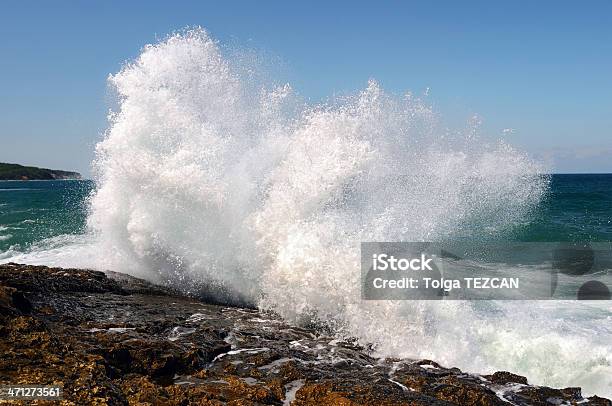 Wave Crashing Against The Beach Stock Photo - Download Image Now - Splashing, Spray, Wave - Water