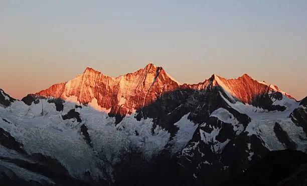 The Mischabel massif in the Swiss Alps at sunrise. These are some of the highest mountain in the Alps with the "Dom" in the middle rising to over 4500m.