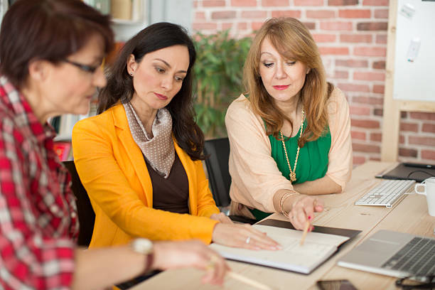 istock Three mature woman working in office. 471276858