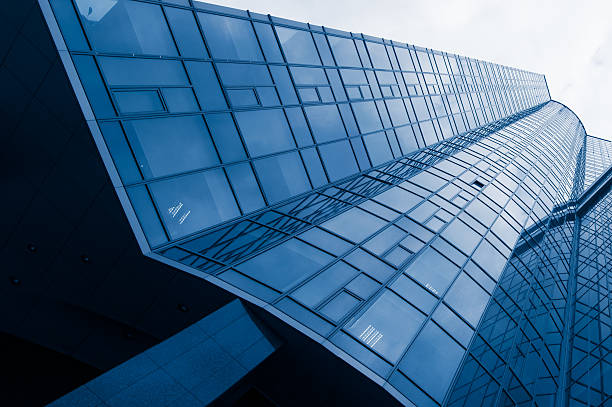 istock High glass office building with clouds. background 471276946
