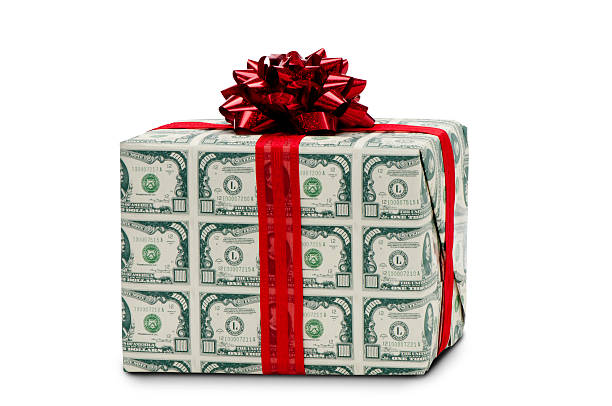 istock Package wrapped w/one thousand dollar bills and red bow-clipping path 471278647