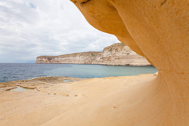 istock Sandstone Coast with old Salt Pans at Xlendi, Gozo, Malta 471279333