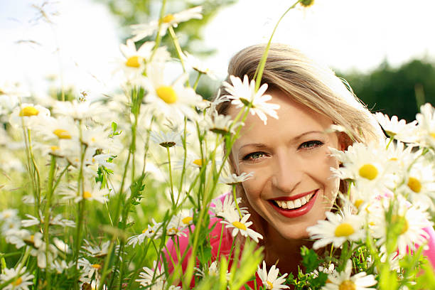 istock Happy woman in flower field 471282534