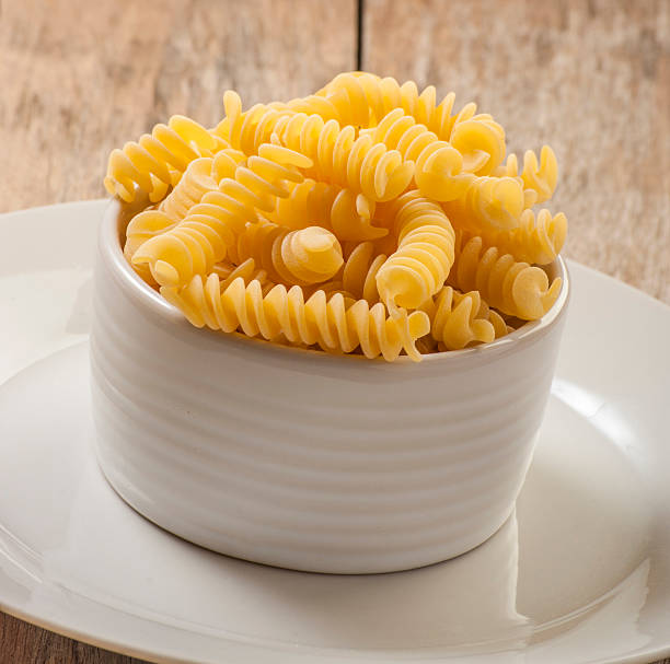 istock pasta on wooden background 471283168
