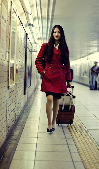 Cute asian woman at the metro station