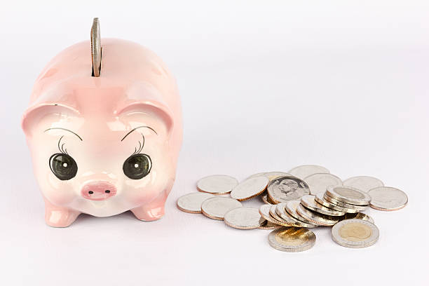 istock Pink piggy bank with coins. 471283718