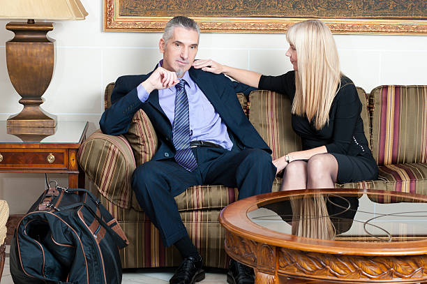 istock Mature Couple Talking in Hotel Lobby 471284333