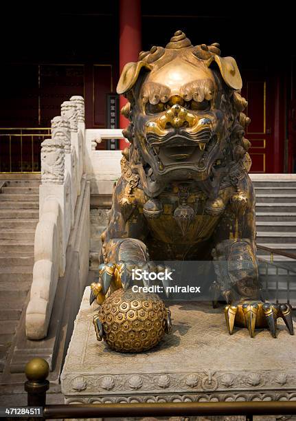 Gilded Chinese Guardian Lion In Forbidden City Beijing Stock Photo - Download Image Now