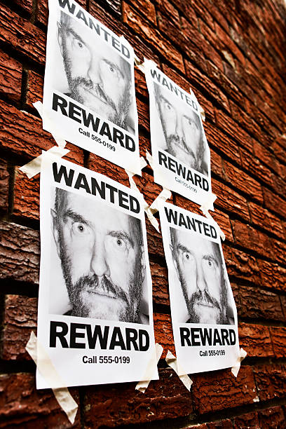 Angled view of four identical 'Wanted' posters