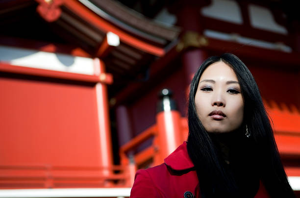 Cute asian woman walking at the streets of Tokyo.