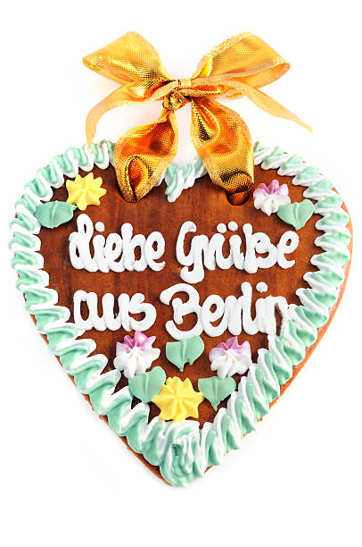 istock Greetings from Berlin gingerbread cookie heart with German words 471288757
