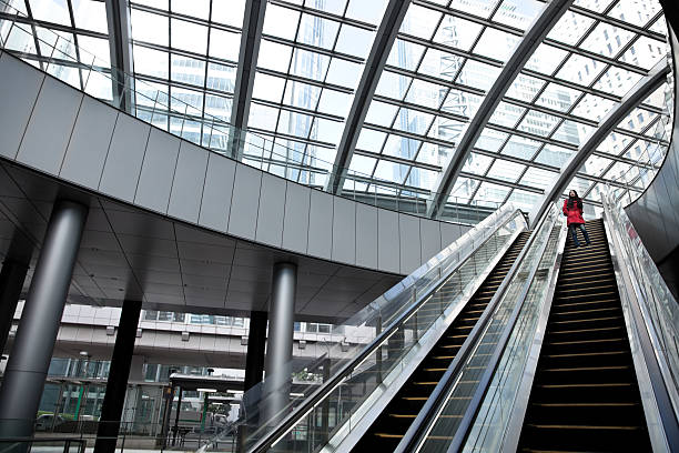 istock Asian woman at an escalator. 471289003