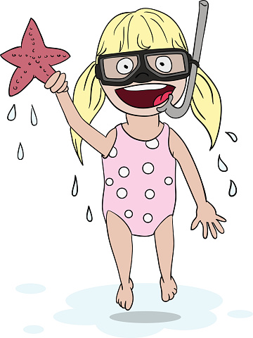 Little blond girl with a snorkel and diving goggles just out of the water. She is very happy and holding a starfish.