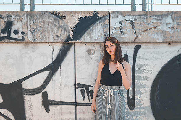istock Beautiful brunette posing in an industrial context 471292916