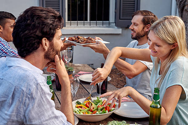 istock friends enjoying garden party 471295926