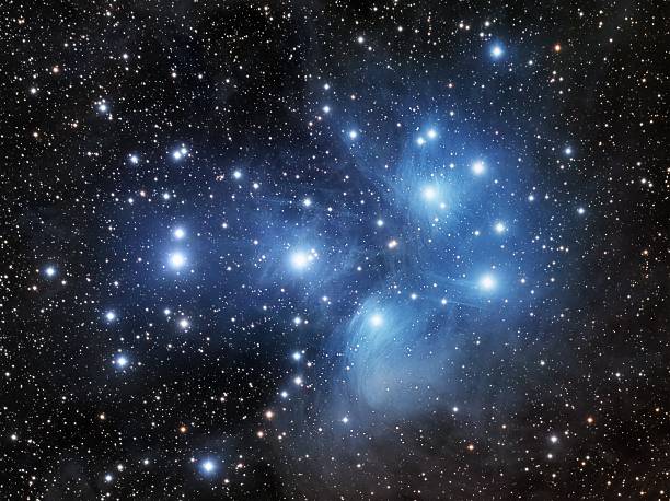 Pleiades, the Seven Sisters The Pleiades (or the Seven Sisters) is the name of an open cluster in the constellation Taurus. taurus photos stock pictures, royalty-free photos & images