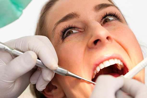 istock Patient with Dentist - dental treatment 471298055