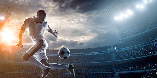 istock A soccer player kicking a ball in the stadium 471298876