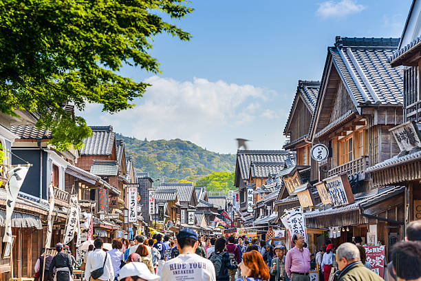 Ise Japan Traditional Street Ise, Japan - April 25, 2014: Crowds walk on the historic shopping street of Oharai-machi. The reconstructed buildings are completed in the Edo period traditional style. mie prefecture photos stock pictures, royalty-free photos & images