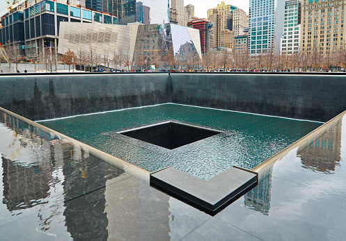 New York, New York, USA - March 11, 2015: The National September 11 9/11 Memorial and Museum at the World Trade Center Ground Zero site. The main memorial commemorating the 2001 September 11 attacks on Manhattan.
