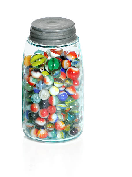 Old Marbles In Mason Jar stock photo